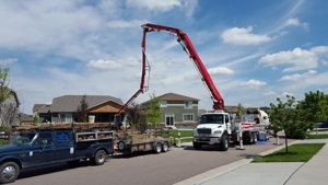 Concrete Trucks in Front of Houses